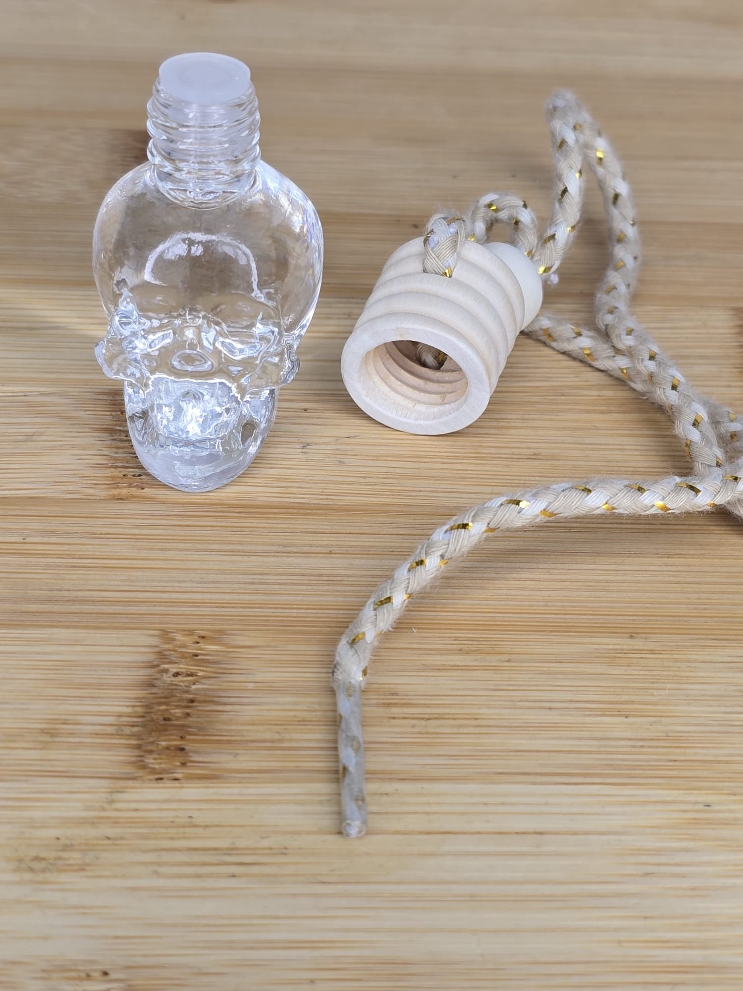 Skull bottle car air freshener.